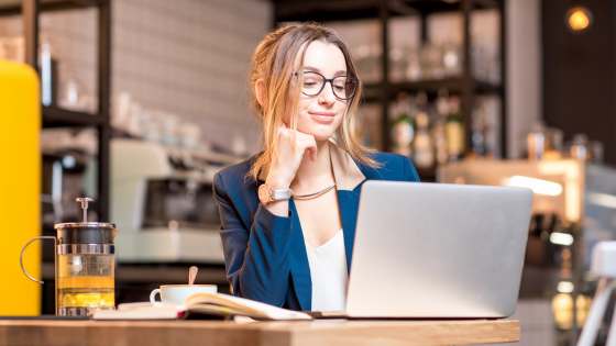 Person Optimizing Event Operations On Laptop